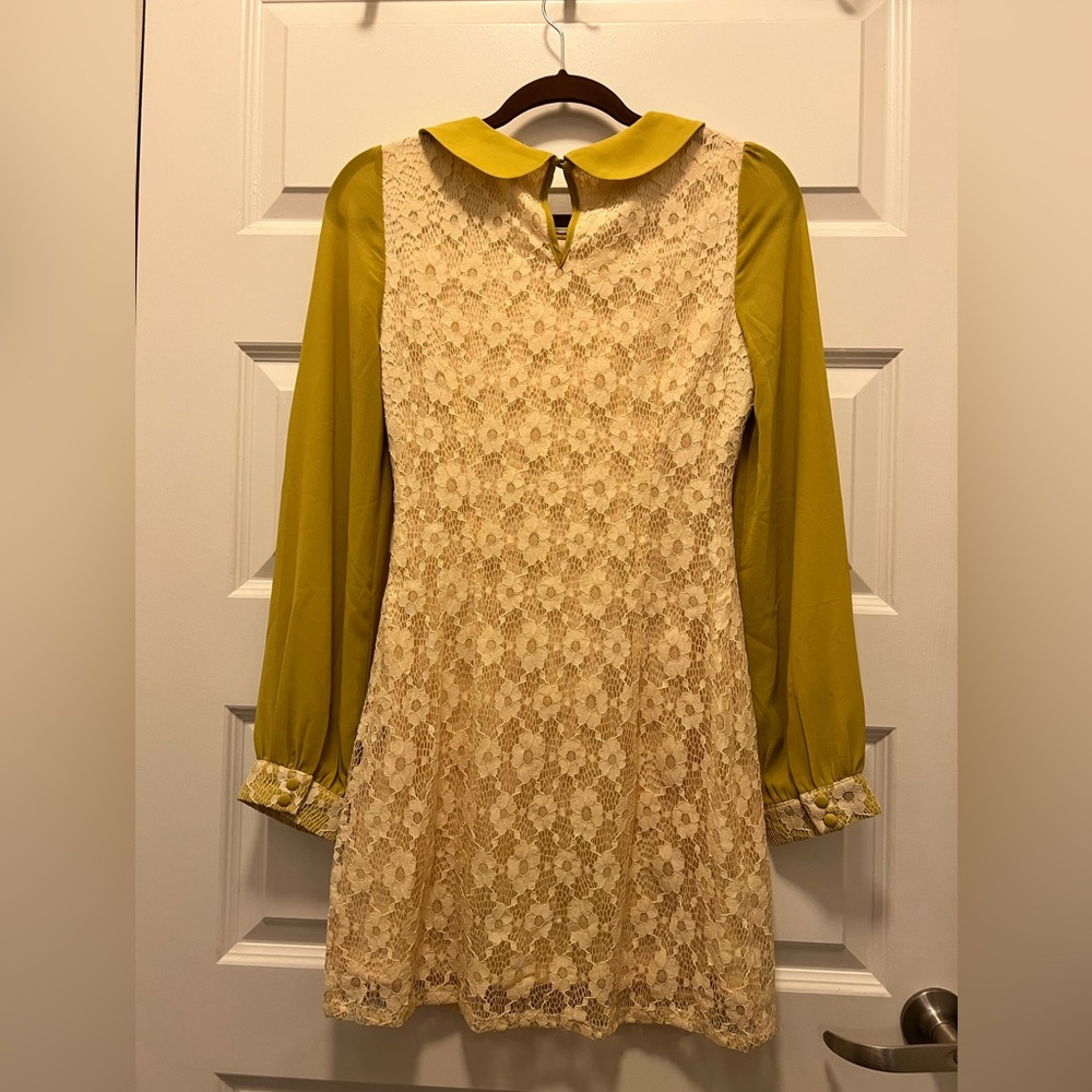 14” across bust, 13” across waist, 32” length from collar to hem.